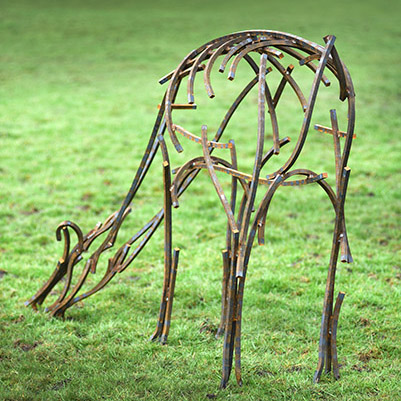 Wildlife Sculpture of a Doe grazing in the field